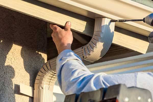 Old gutter being replaced